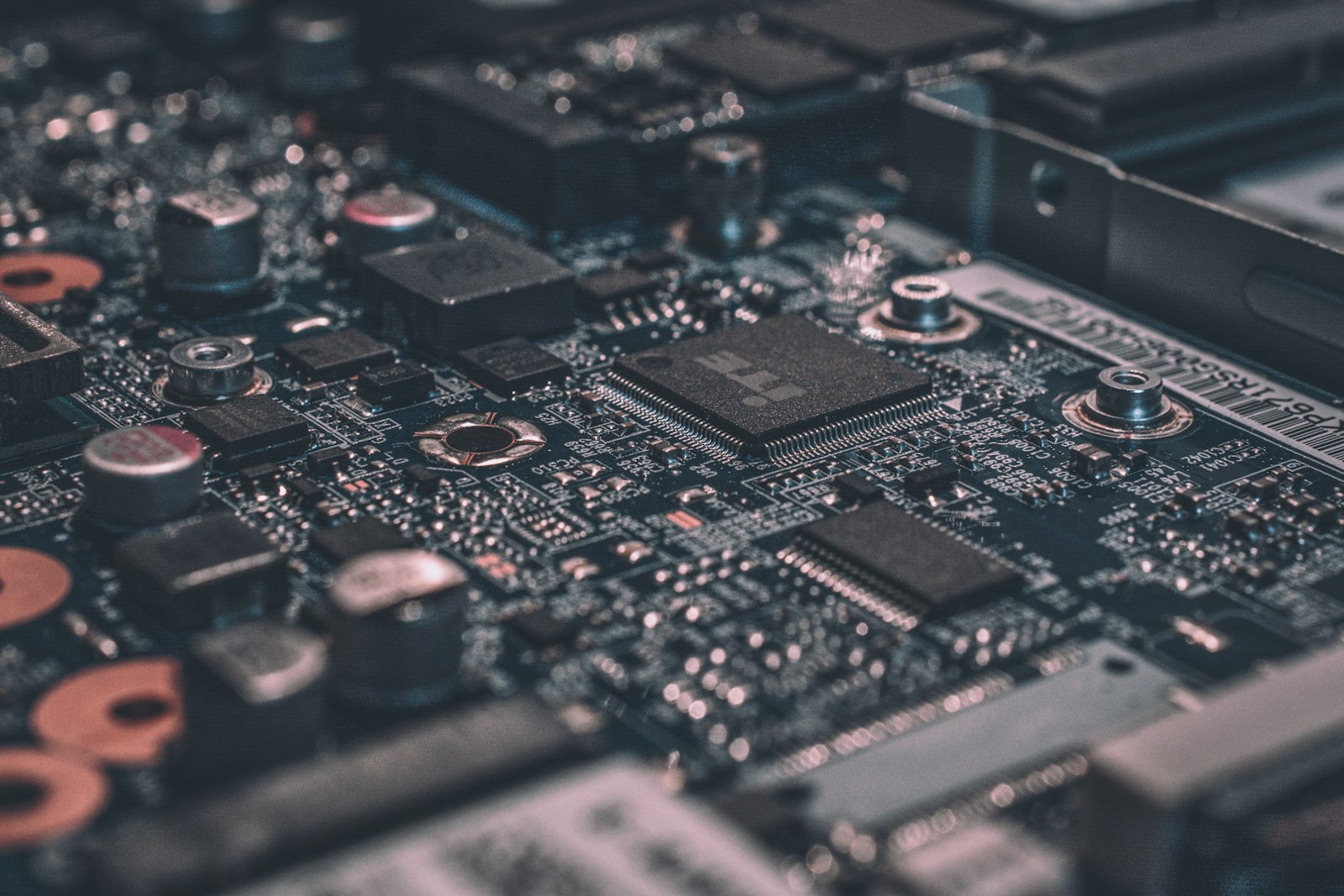 A close-up of a circuit board with chips and traces