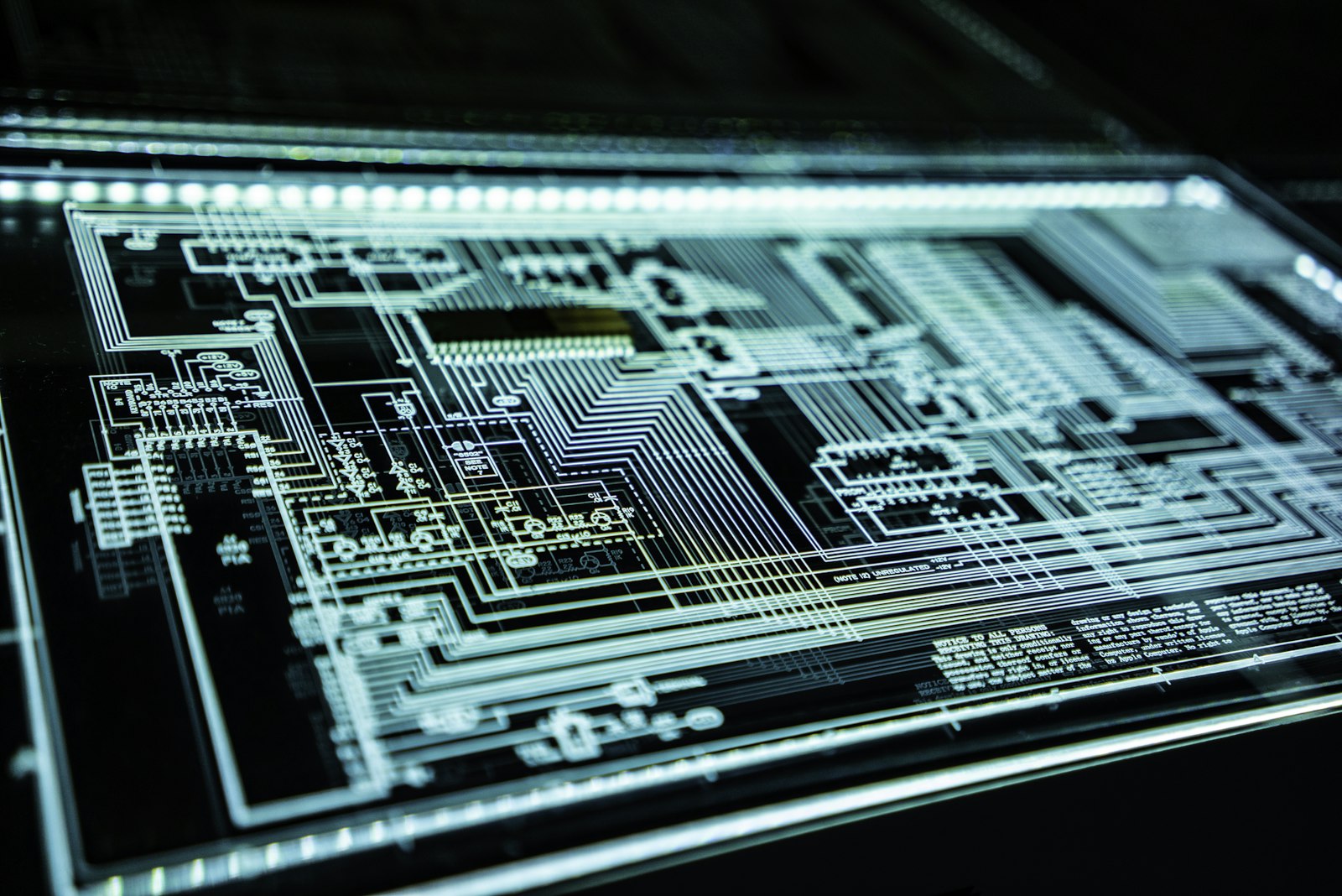Blue lines of a circuit diagram lit from behind